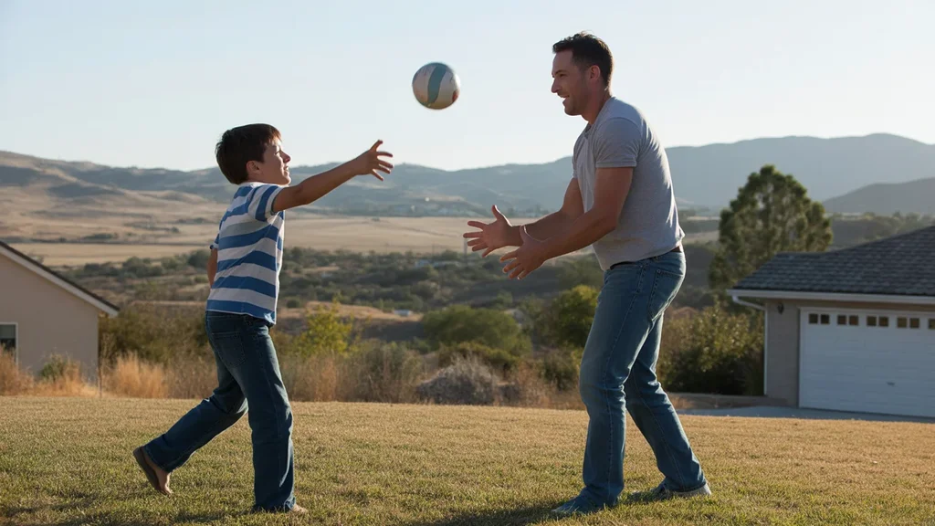 Father and son playing in front yard of Murrieta house at sunset